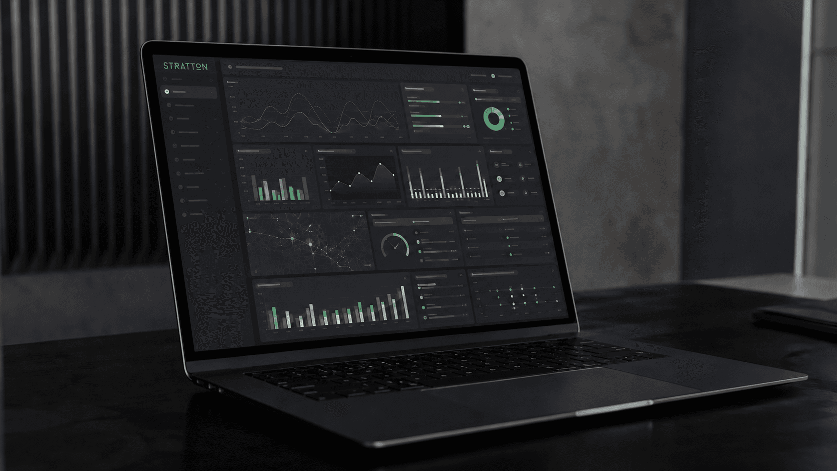 A Stratton operational dashboard shown on a laptop at a working desk.