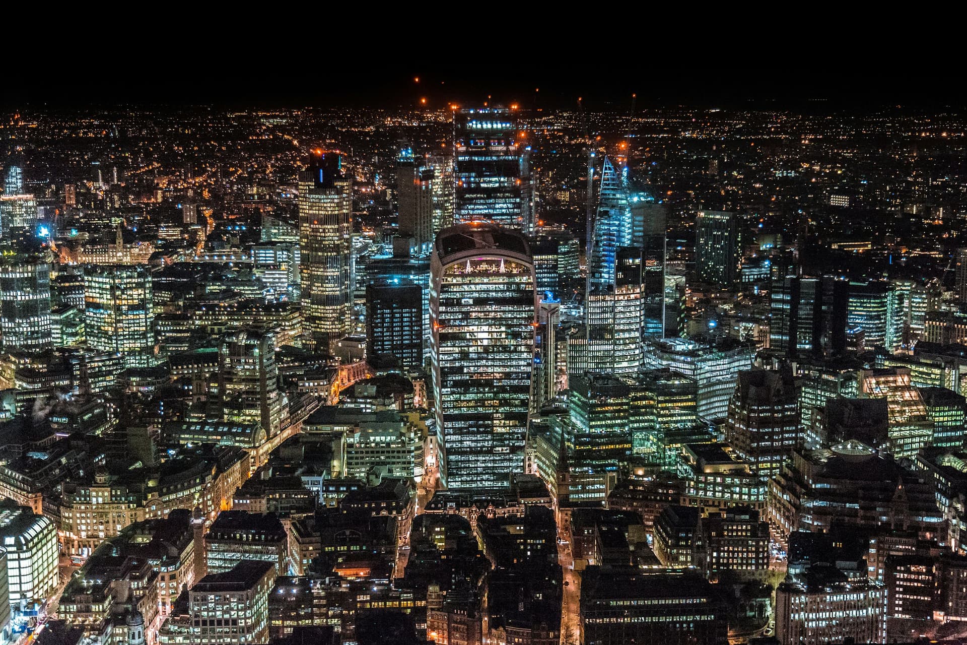 The City of London from the air at night, every building lit.